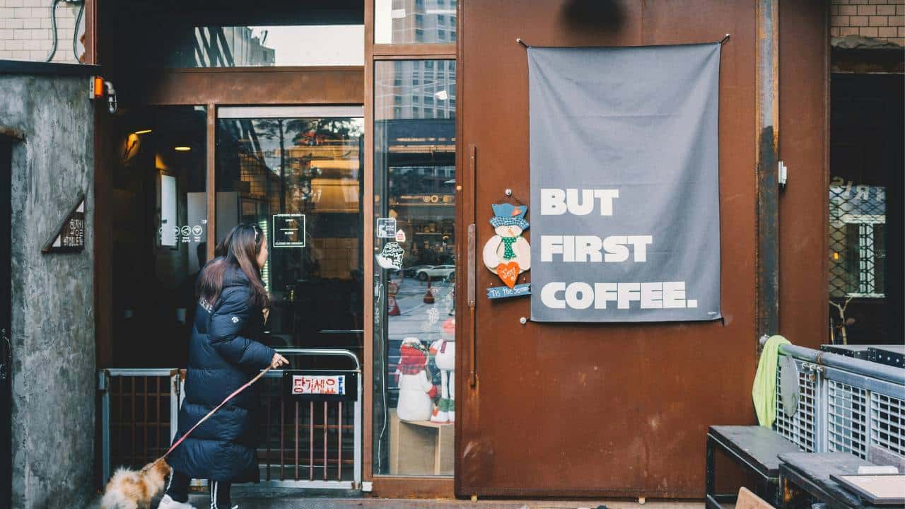 A banner with "but first coffee" written on it