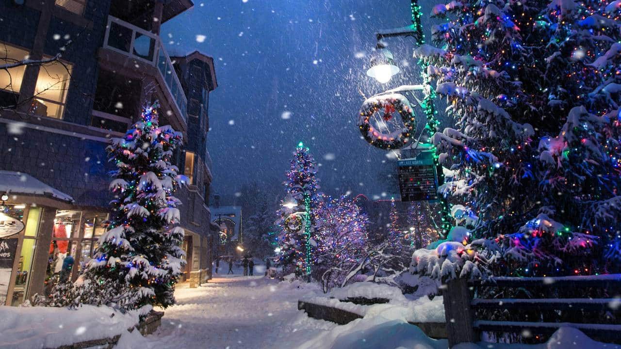 A snow-covered street with Christmas decorations