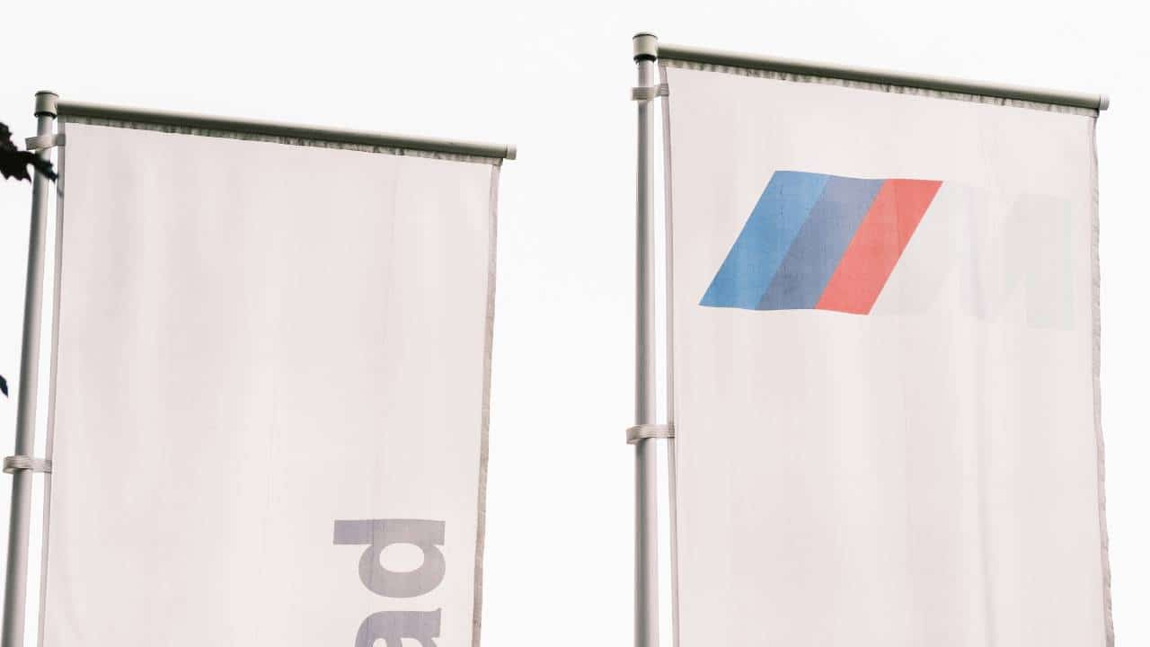 Two white corporate flags
