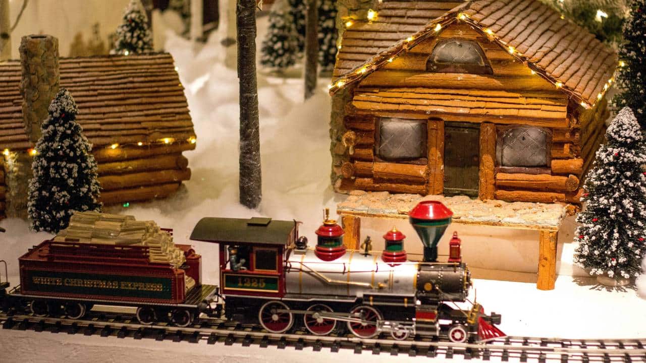 A small-scale train in a Christmas scene