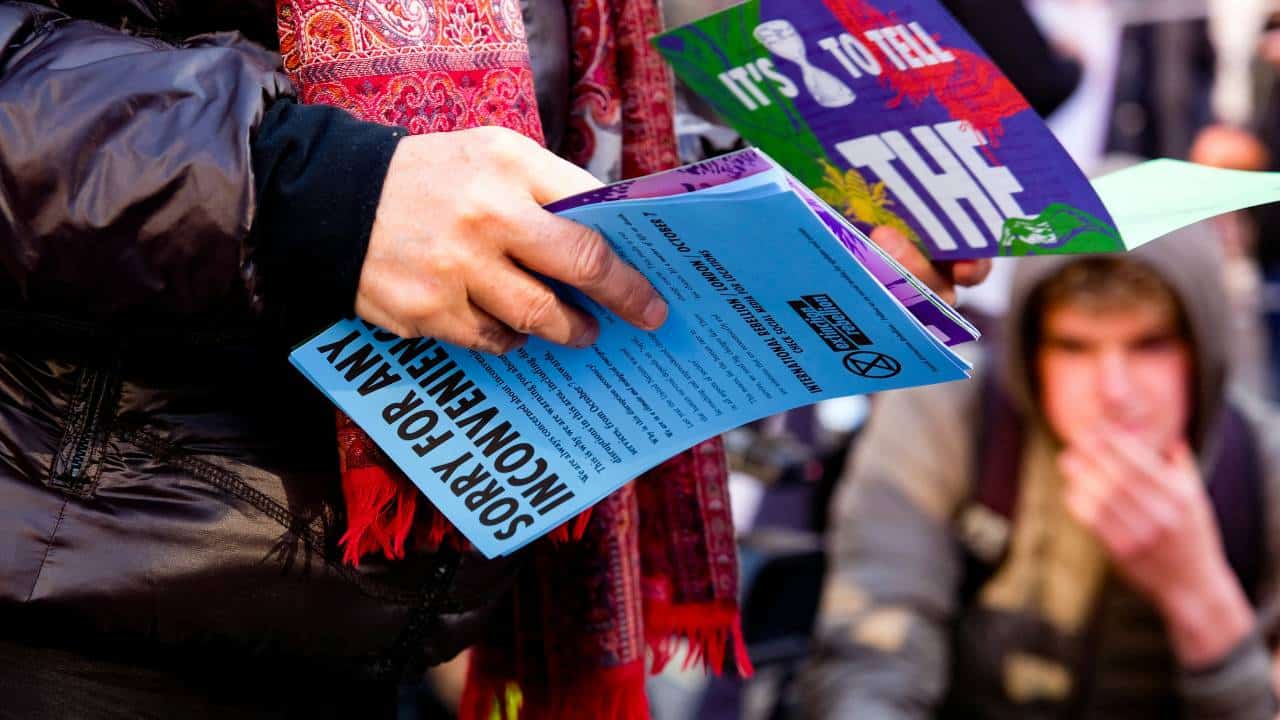 Person handing out colourful flyers