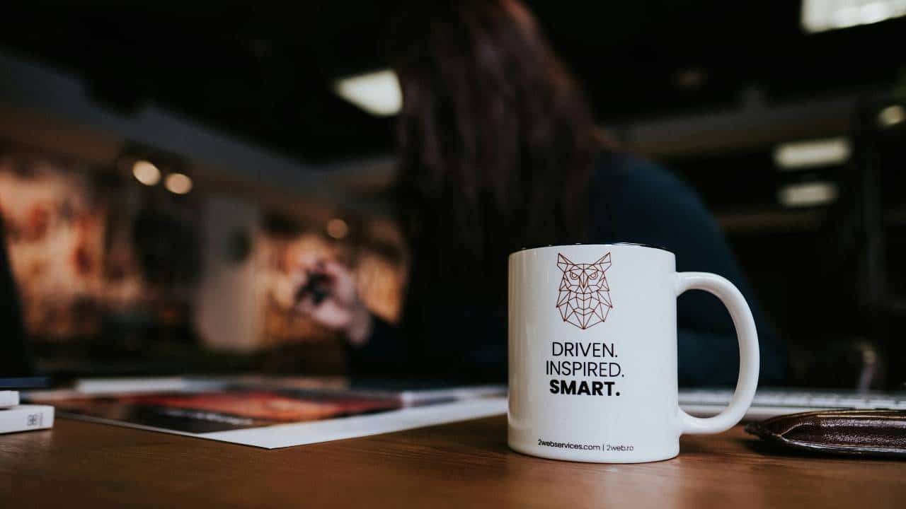 A cup of coffee with a tagline