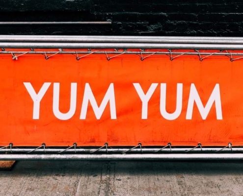 Person writing copy for effective banner advertising.