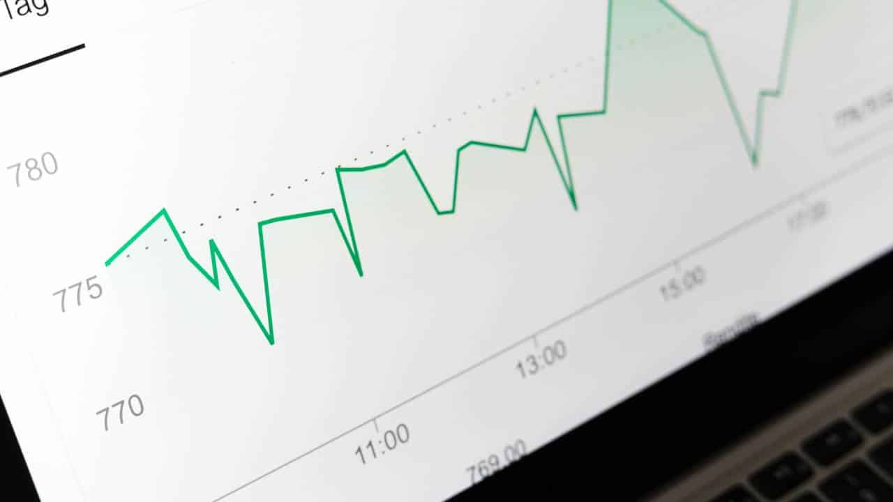 A revenue graph shown on a laptop's display