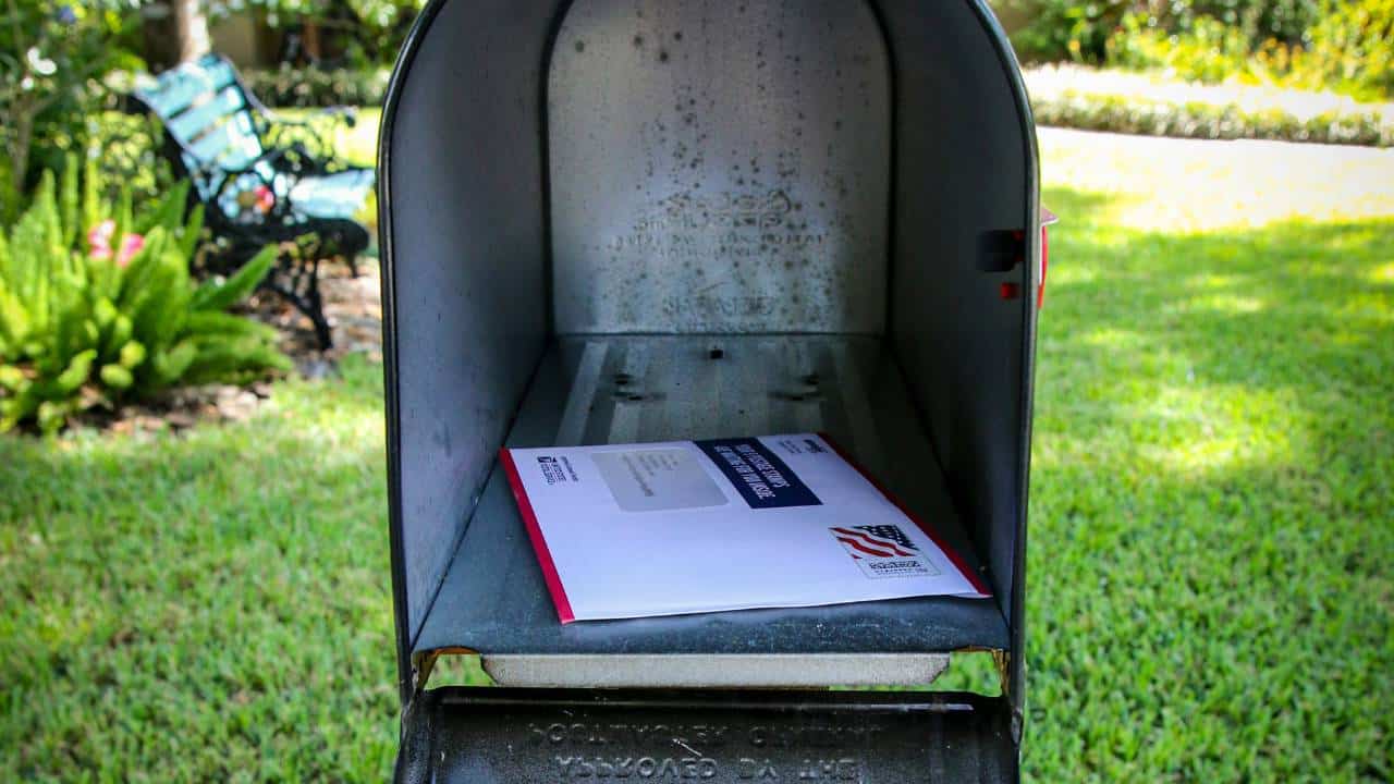 A mailbox with a letter in it