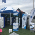 Printed gazebo assembled at an outdoor branded event.