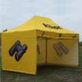 Branded gazebo with printed half-wall panels at event.