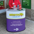 Branded round counter display with custom printed wrap.