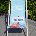Edgard and Cooper branded printed deckchair at outdoor event.