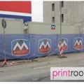 Branded heras fencing cover for outdoor event perimeter.