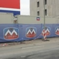 Custom mesh banner for outdoor events and construction sites.