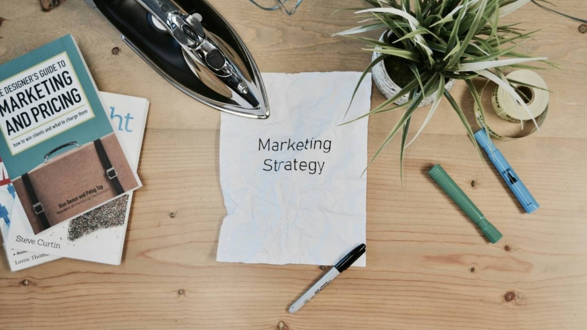 A piece of paper with "marketing strategy" written on it