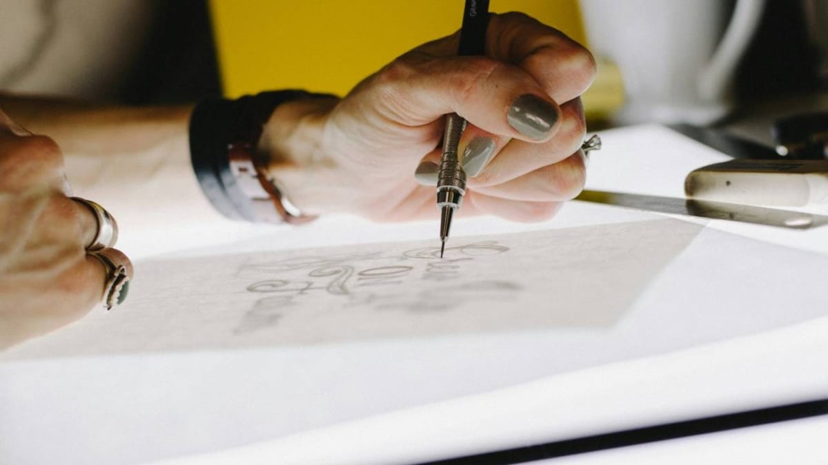 A woman in the process of designing a new logo