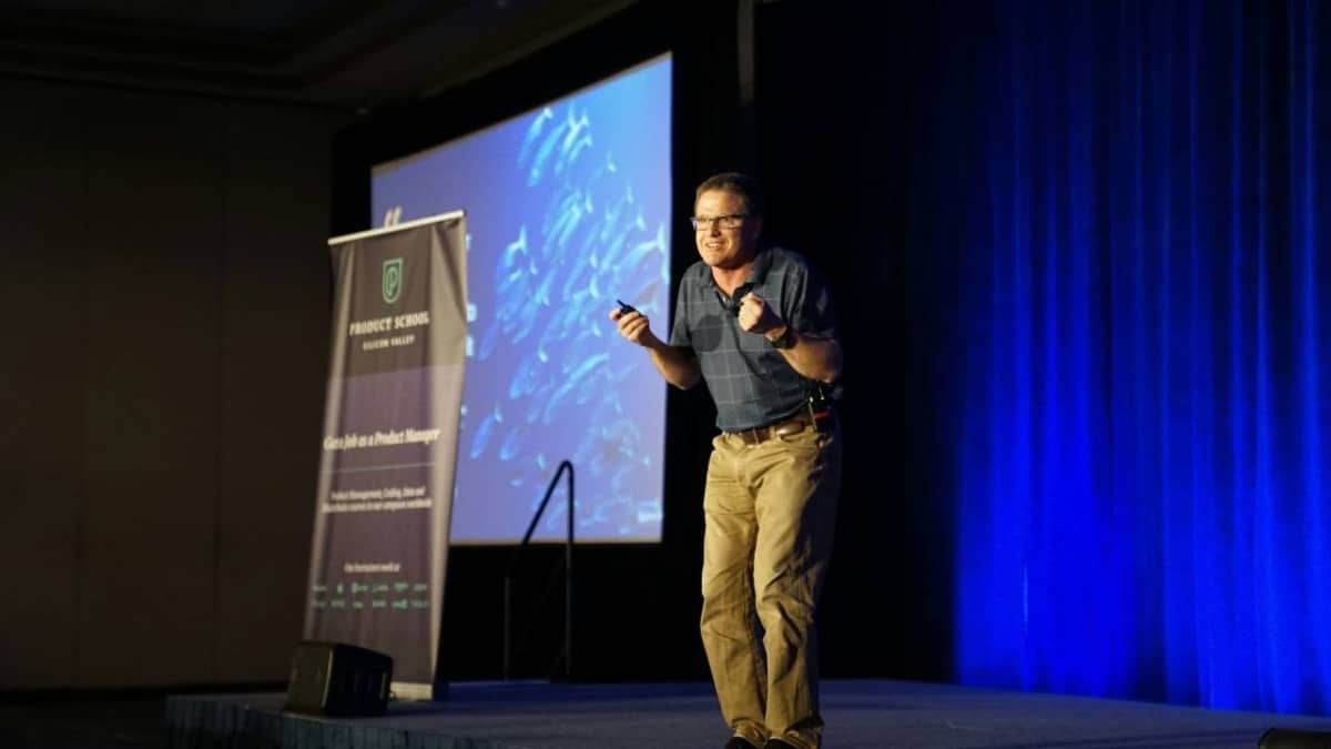 A man speaking at a business conference
