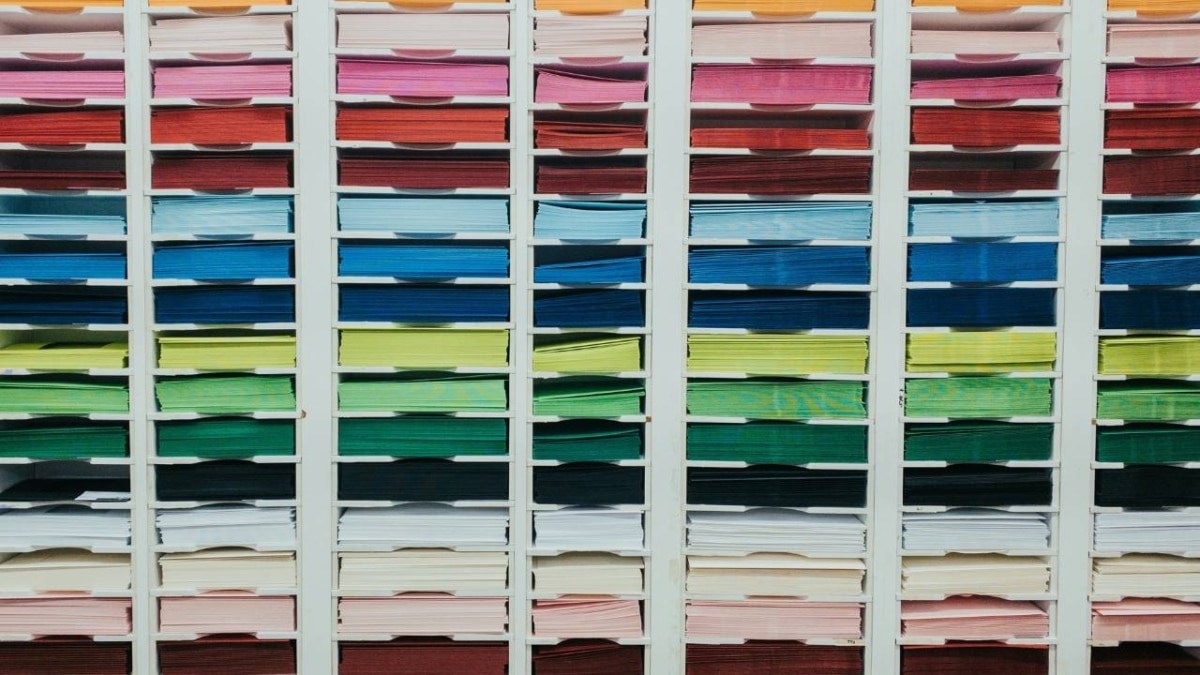 Several stacks of papers of different colours