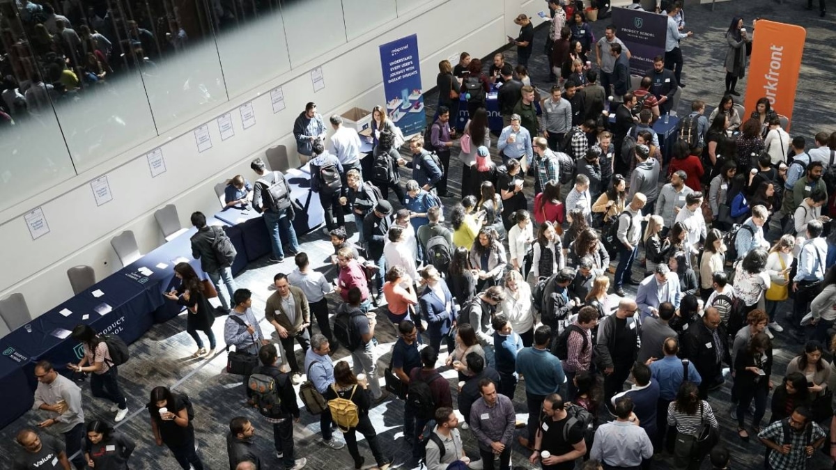 Dozens of people attending a trade fair