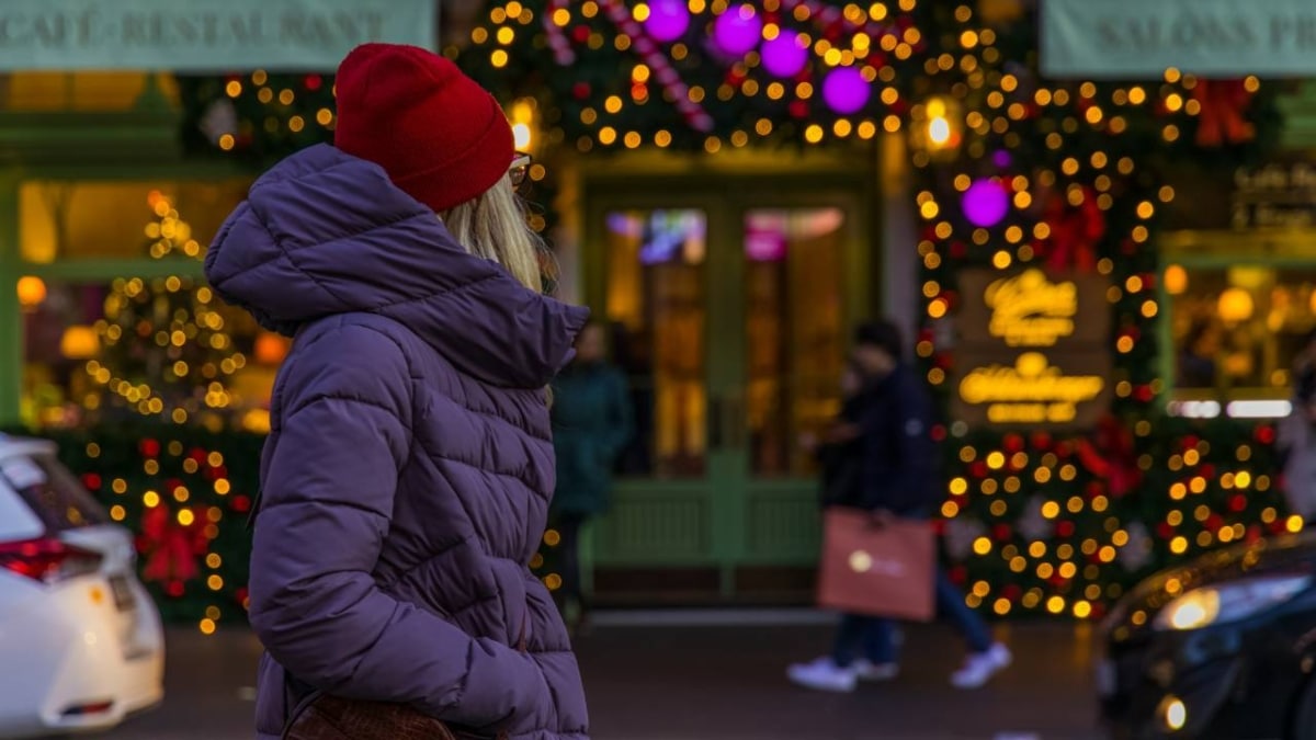 A photo of a woman talking a walk at the Christmas fair